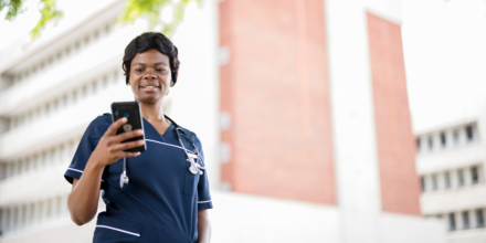 A healthcare worker on her mobile phone