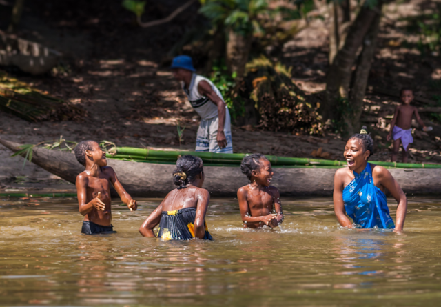 A family playing canal water