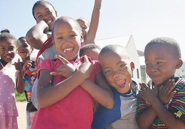 South African children playing and smiling for the camera