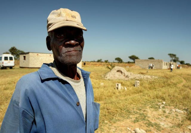 A Zambian farmer standing in a field